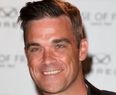 Robbie Williams and Wife Return Home for the Birth of Their Baby