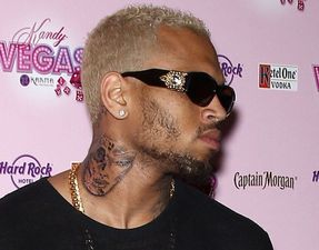 Chris Brown Unveils New Tattoo On His Neck… Of A Beaten-Up Woman