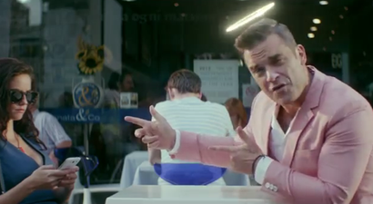 First Look: Robbie Williams Rocks Out In Pink In His New ‘Candy’ Music Video