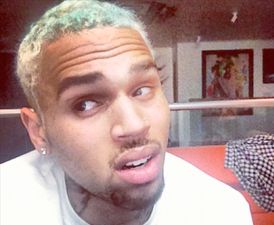 Chris Brown Debuts Another Ugly Tattoo in The Same Place as Rihanna’s