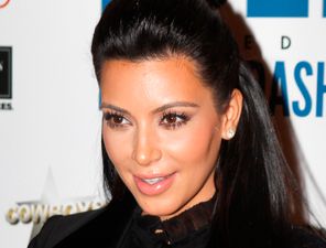 Whoa! Is Kim Kardashian Changing Her Signature Style Now She’s Expecting?