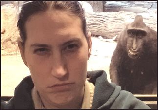 Photobombing, You’re Doing It Right: Naughty Monkey Pulls A Cheeky Grin In Zookeeper’s Snap