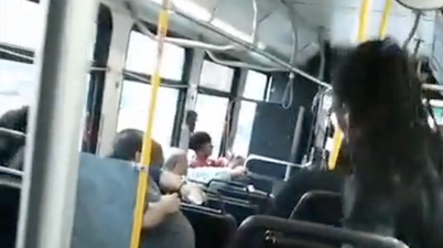 VIDEO: Shocking Footage of Mother Throwing Baby to a Stranger Before Lunging at Fellow Passenger