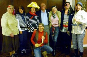 Parkham’s Women’s Institue Dress Up As Pirates For Sea Captain’s Visit, Little Did They Know He Was There To Discuss His Abduction… By Pirates