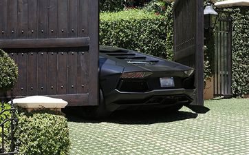 PHOTOS: Watch Kanye’s Luxury Lamborghini Get Crushed By Kim’s Electric Gates