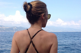 Singer Shows Off Famous Derriere In Holiday Snap