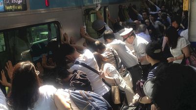 Photo: Mind the Gap! Japanese Commuters Rally Together to Free Woman Trapped Under 32 Tonne Train