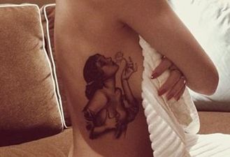 PICTURE: Pop Star Gets Pinup Girl Tattooed On Her Side