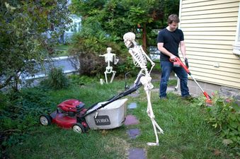 Photos: How “Humerus”! Man Carries Out Everyday Tasks With Two Plastic Skeletons By His Side