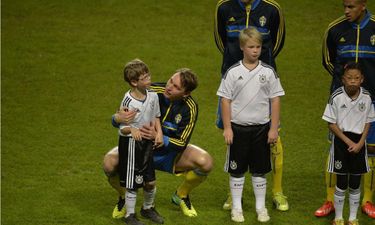 PICTURE – Swedish Football Player Comforts Frightened Child At World Cup Qualifying Match