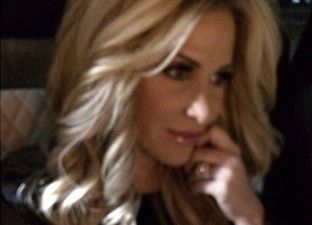 PICTURE: TV Star Snuggles Up To One of Her Newborn Twins