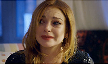 “He’s Married With Kids” – Lohan Tells Reporter About New Man While Sipping Vodka On The Rocks