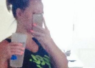 PICTURE: Singer Shares Snap Of Baby Bump On Twitter