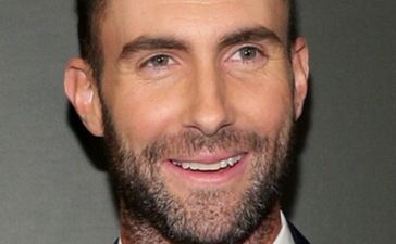 OUCH! Adam Levine Accidentally Clocks Fan On The Head With Microphone