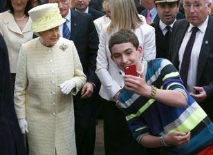Absolute Chancer! This Kid Was Taking A Selfie With The Queen No Matter What