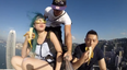 WATCH: Three People Stand Atop A Skyscraper To Eat Bananas… Because That’s Good Craic