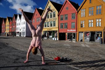 A Sight To See! Ballsy Tourist Travels Across The Globe Performing Naked Handstands at Landmarks