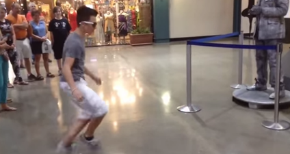 WATCH: Boy-vs-Human Statue Have An Incredible Dubstep Dance-Off. We Want These Moves!