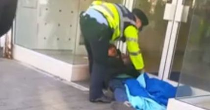WATCH: Shocking Video Of Garda Allegedly Pepper-Spraying A Homeless Man In Dublin Has Gone Viral