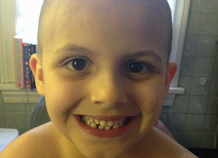 PIC: A Mum Let Her 6-Year Old Shave Her Head So She Could Look Like Her Dad