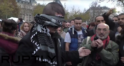 WATCH: A Blindfolded Muslim Man Stood In Paris Offering People Free Hugs