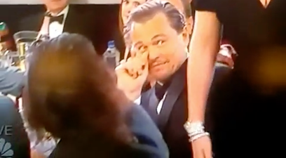 WATCH: Leonardo DiCaprio’s Face When Lady Gaga Bumps Off Him Is Priceless