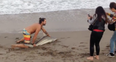Man Pulls Struggling Shark From Water To Pose For Pictures