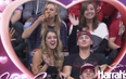 This American girl got caught rapid hoovering up pizza on a Kiss Cam