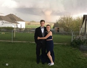 PICS: Prom dates get photobombed by tornado and instead of running they took selfies