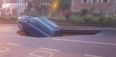 A huge sinkhole has appeared in a road in London and swallowed a car