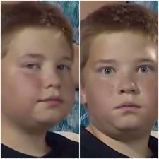 This boy staring into the camera at a baseball game is one dedicated dude
