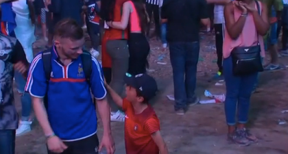 This young Portuguese fan consoling a French fan is too much