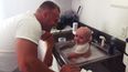 Policeman rescues baby and pops him in the station sink for a bath