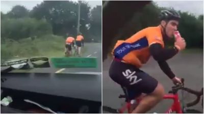 Festival goers on the way to Electric Picnic help a thirsty cyclist well on his way