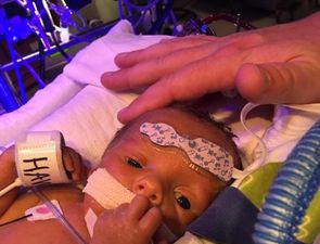 An image of a newborn hugging his sick brother has broken hearts everywhere