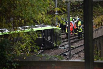 Five people have been killed and two remain trapped after a train derailed in London