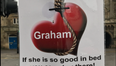 A love-scorned woman has erected these brutal posters about her ex