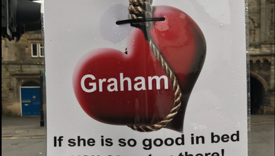 A love-scorned woman has erected these brutal posters about her ex