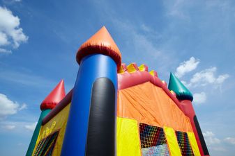 A six-year-old has died, and six others were injured, after a bouncing castle exploded