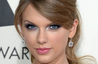 Bridesmaid Taylor Swift wears a red maxi-dress to her mate’s wedding