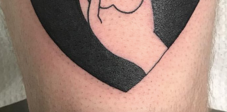 This tattoo of a hand and a heart looks like a hand and… something else