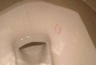 Someone kissed the inside of a toilet bowl and no one can figure out why