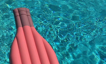 This wine bottle pool float is exactly what we need this summer