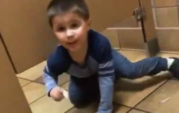 A little boy innocently climbed under a man’s bathroom stall while he was using the toilet