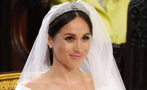 We have a clip of Meghan Markle reacting to her wedding dress and she's predictably adorable