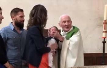 Priest loses temper and slaps crying baby during christening service