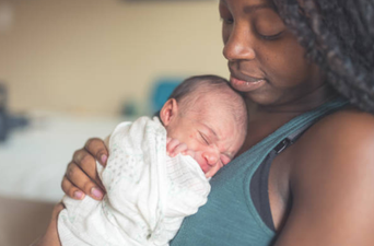 Why do some mothers want to lick their babies after giving birth?