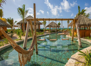 This company wants to pay you €100,000 to fly to resorts, eat Mexican food and party