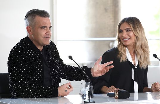 LONDON, ENGLAND - JULY 17: Robbie Williams and Ayda Field speak during The X Factor 2018 launch at Somerset House on July 17, 2018 in London, England. (Photo by John Phillips/Getty Images)