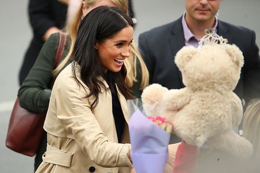 Meghan breaks royal protocol taking a snap with a fan who looks like her